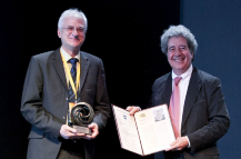 Prof. Thomas Ertl and Prof. Pere Brunet, chair of the Eurographics committee, during the award ceremony (Image: Eurographics 2016)